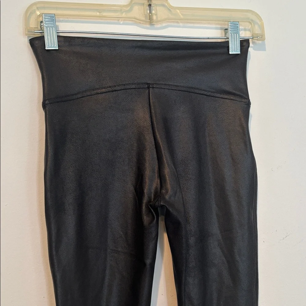 Spanx Women’s Black Faux Leather Leggings in a size Small.